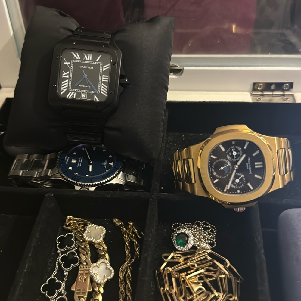 Santos De Cartier. Retails at $8,300. Come with a reasonable offer.
